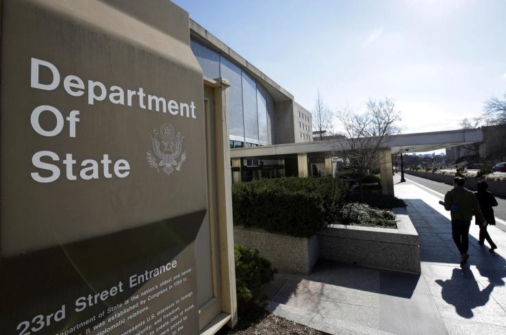 People enter the State Department building in Washington, DC.