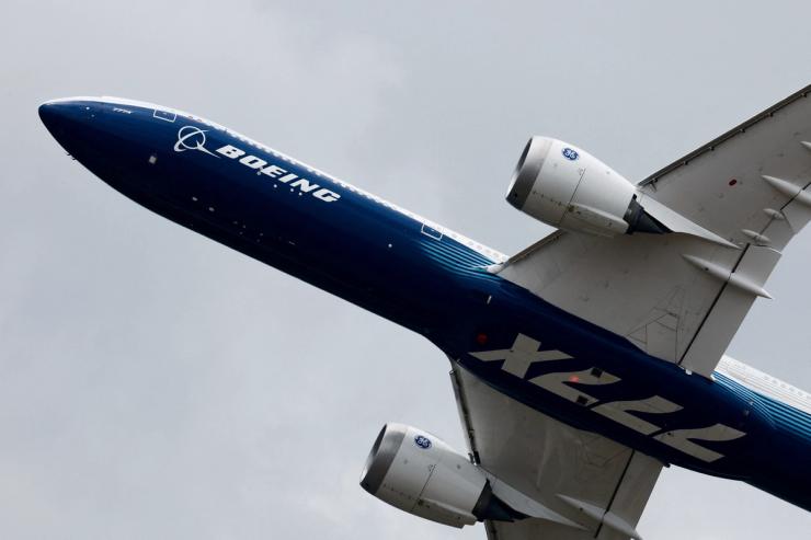 A Boeing 777-9, a variant of the 777X, performs a flying display at the 54th International Paris Airshow at Le Bourget Airport near Paris.