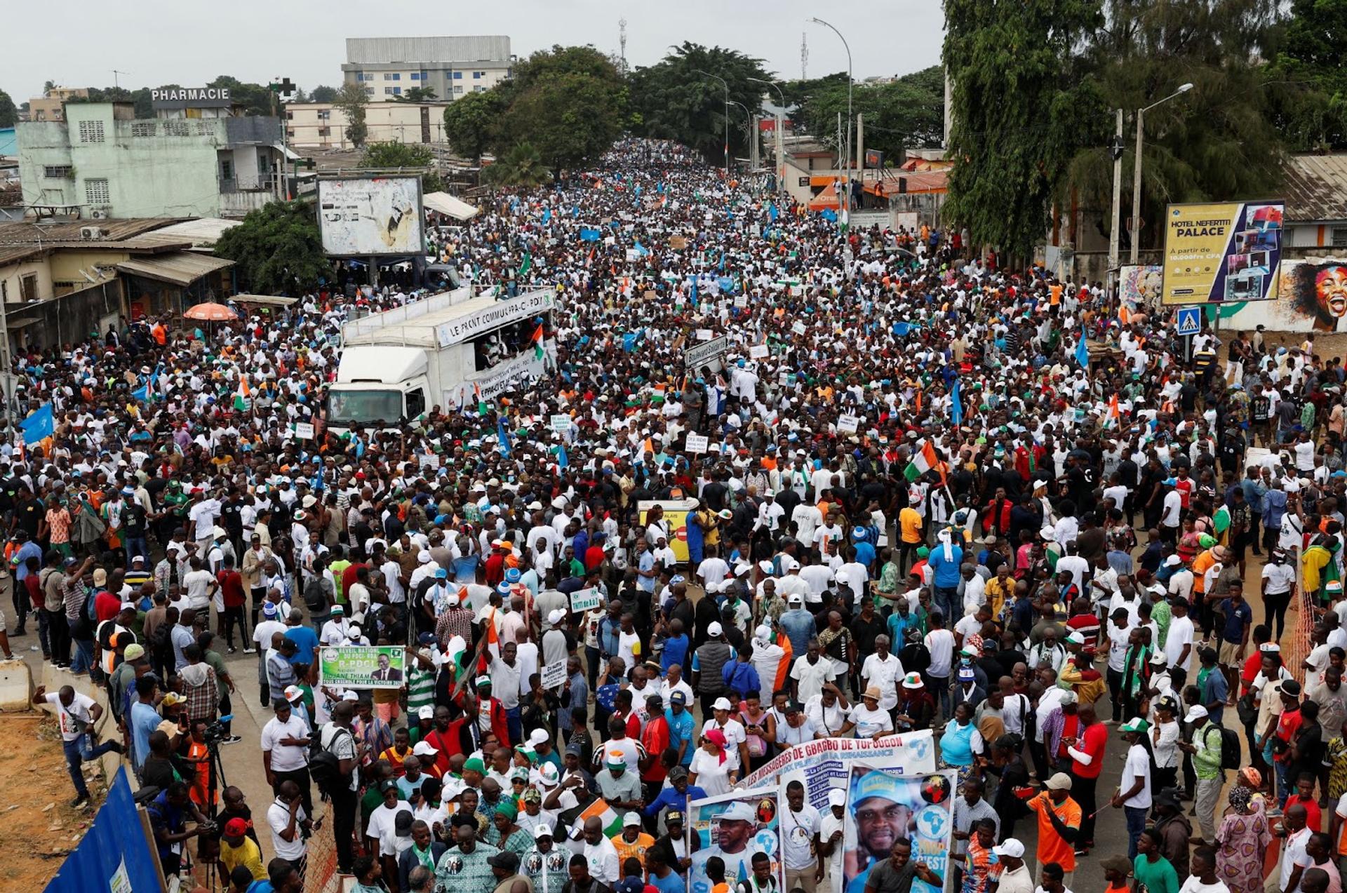 Thousands march in protest against opposition leaders, Tidjane Thiam and Laurent Gbagbo, being barred from the electoral list. 
