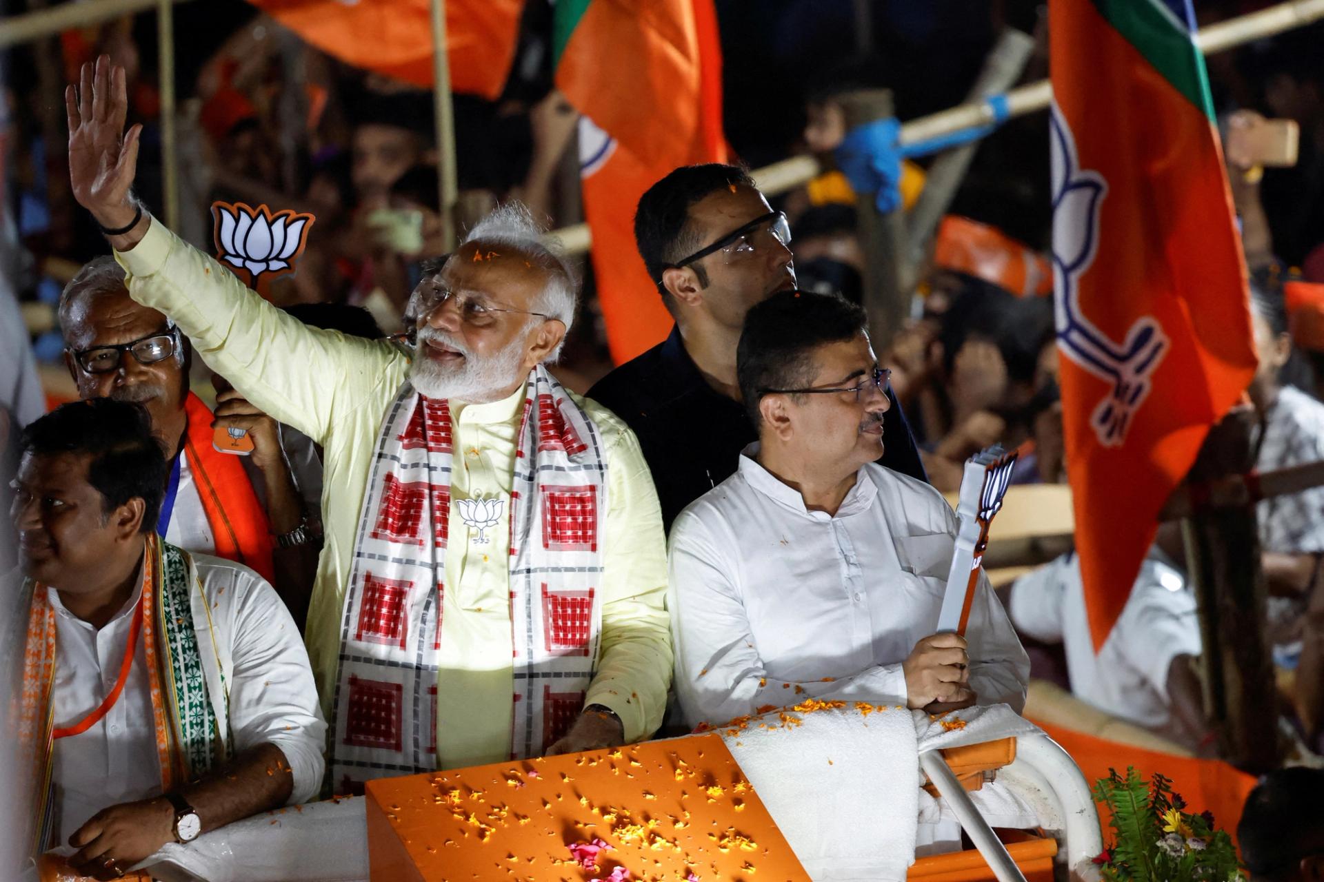 FILE PHOTO: India's Prime Minister Narendra Modi waves towards his supporters during a roadshow as part of an election campaign, in Kolkata, India, May 28, 2024. REUTERS/Sahiba Chawdhary/File Photo