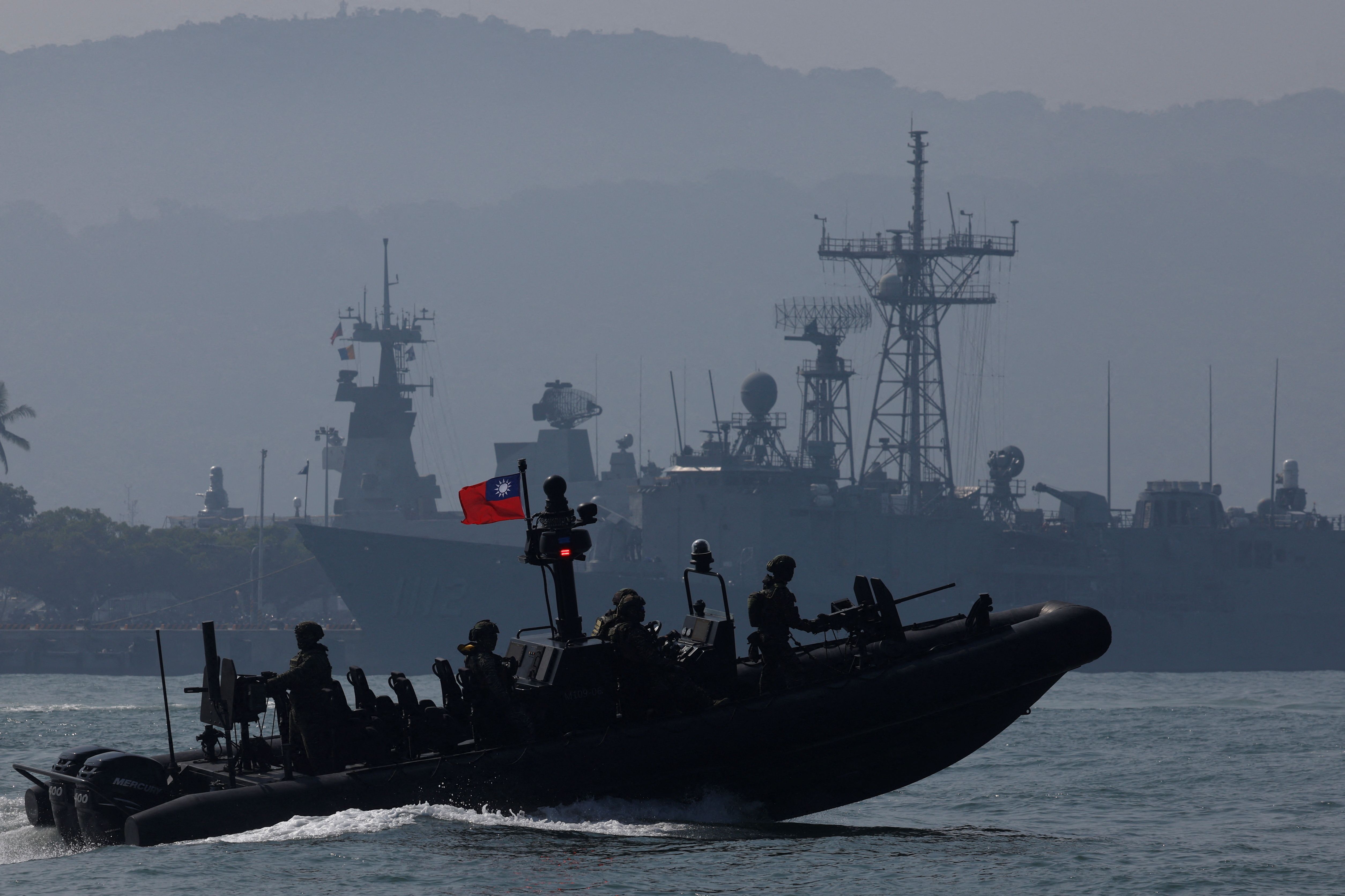 Members of Taiwan’s Navy navigate onboard a special operation boat during a drill part of a demonstration for the media, to show combat readiness ahead of the Lunar New Year holidays, on the waters near a military base in Kaohsiung, Taiwan
