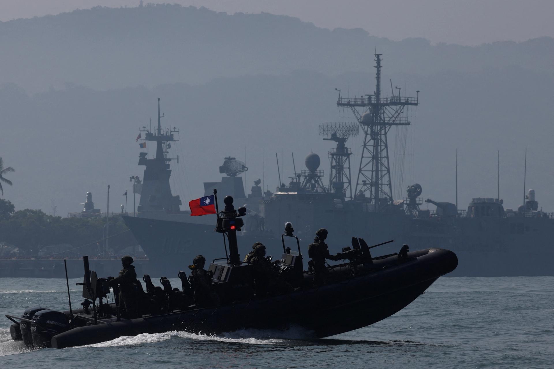 Members of Taiwan's Navy navigate onboard a special operation boat during a drill part of a demonstration for the media, to show combat readiness ahead of the Lunar New Year holidays, on the waters near a military base in Kaohsiung, Taiwan