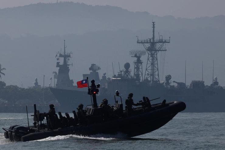 Members of Taiwan’s Navy navigate onboard a special operation boat during a drill part of a demonstration for the media, to show combat readiness ahead of the Lunar New Year holidays, on the waters near a military base in Kaohsiung, Taiwan