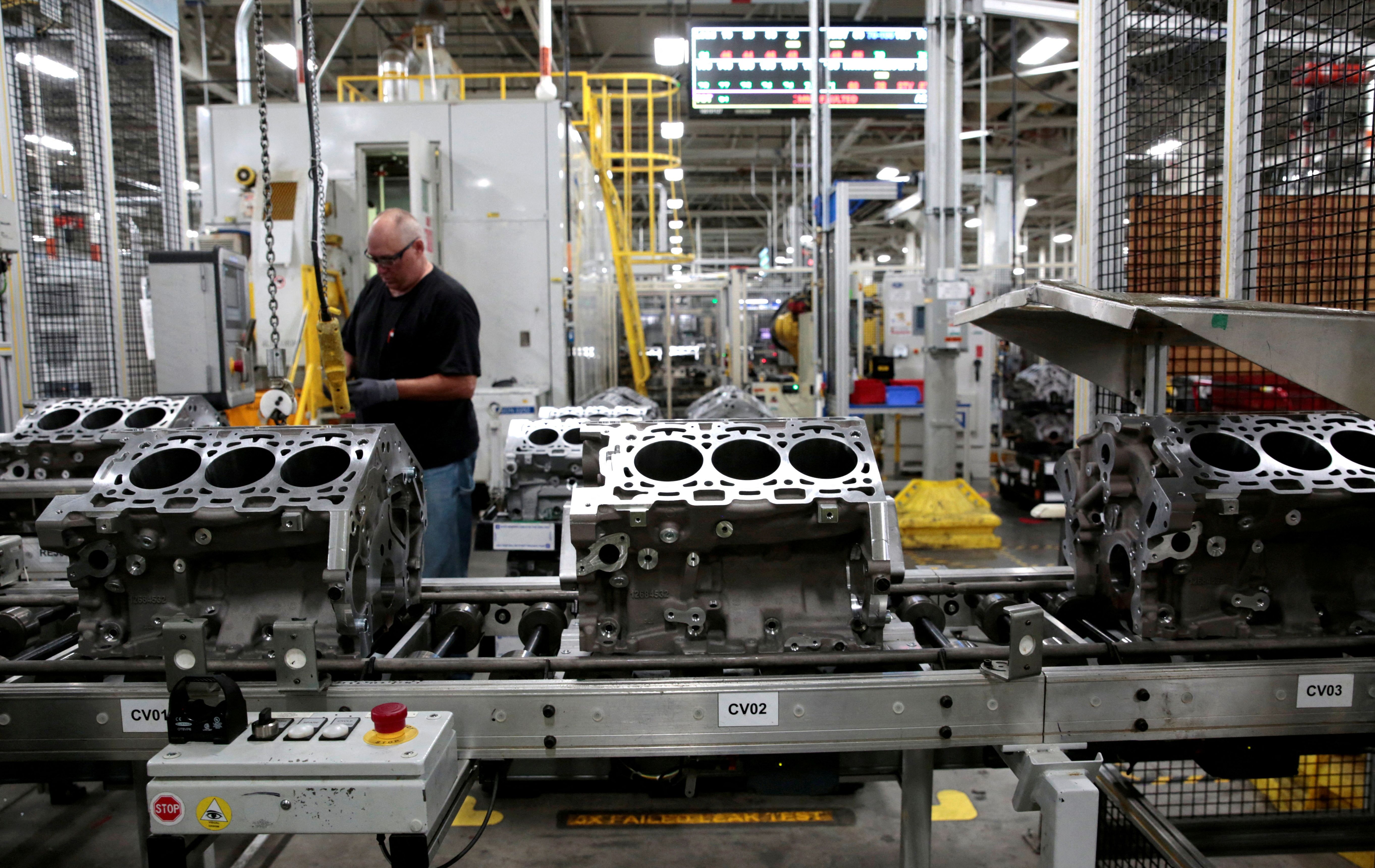 Engine casting blocks, used in a variety of General Motors cars, trucks and crossovers, move down the assembly line at the GM Romulus Powertrain plant in Romulus, Michigan