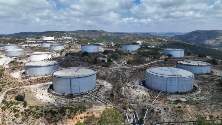 A drone view shows oil storage tanks in Syria