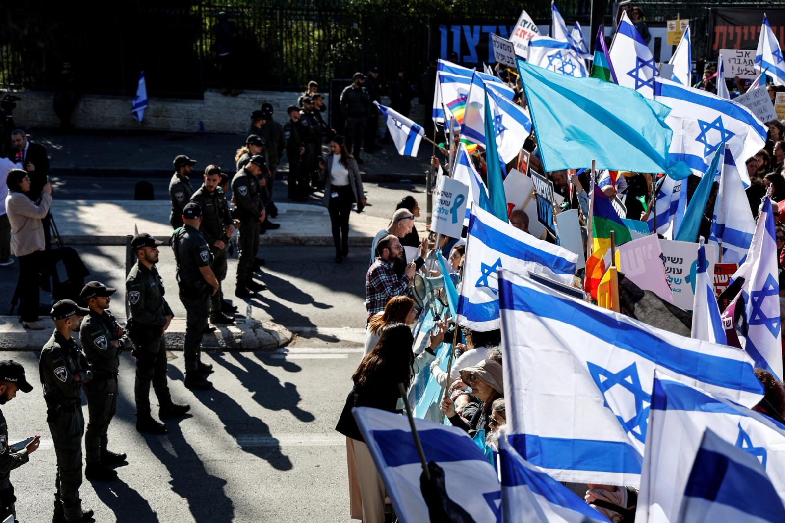 Israelis protest outside Israel's parliament on the day that a new right-wing government is sworn in in Jerusalem
