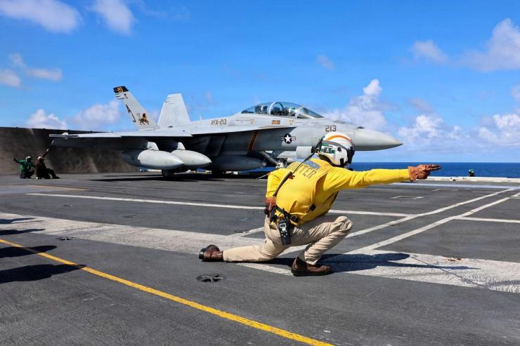 A US fighter jet takes off from an aircraft carrier