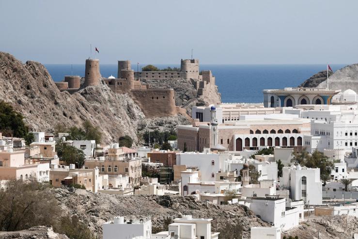 The Al Mirani Fort and traditional houses are surrounded by mountains, in Muscat.