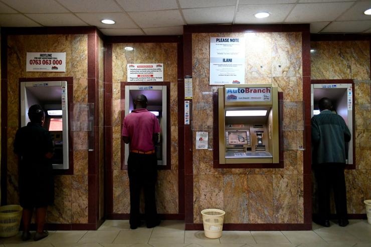 Customers queue at the Equity bank on Mama Ngina street in Nairobi.