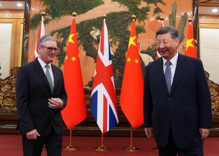 Britain’s Prime Minister Keir Starmer greets Chinese President Xi Jinping