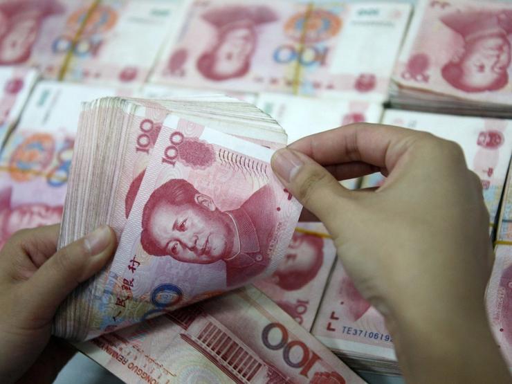 A man counts yuan