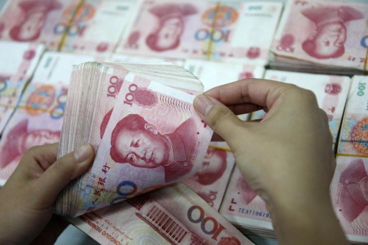 A man counts yuan