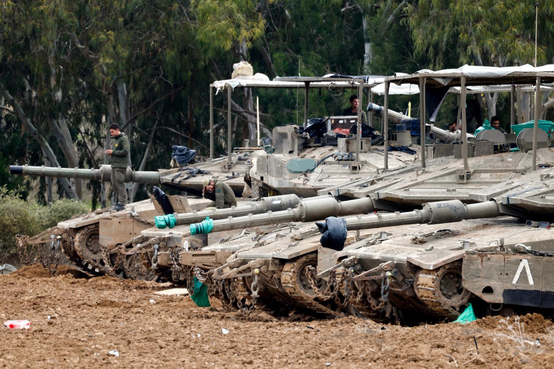 Israeli soldiers rest on their tanks, on the Israeli side of the border with Gaza, amid a ceasefire between Israel and Hamas, in Israel February 9, 2025.