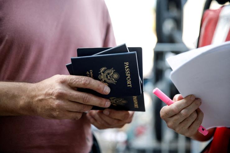 Someone holding a stack of US passports