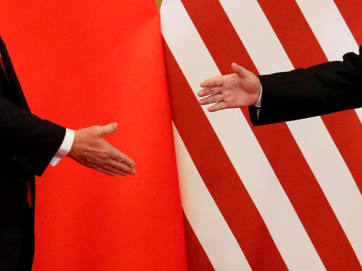 US President Donald Trump and China’s President Xi Jinping shake hands after making joint statements at the Great Hall of the People in Beijing, China, November 9, 2017.