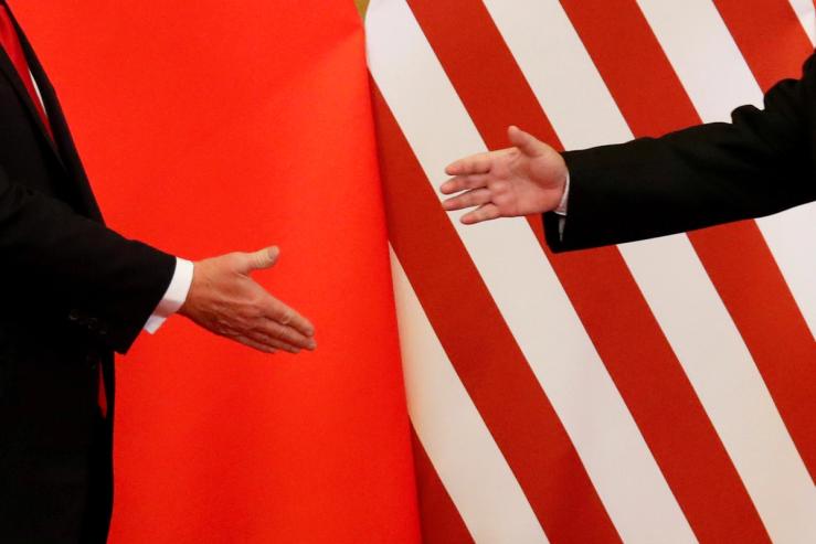 US President Donald Trump and China’s President Xi Jinping shake hands after making joint statements at the Great Hall of the People in Beijing, China, November 9, 2017.