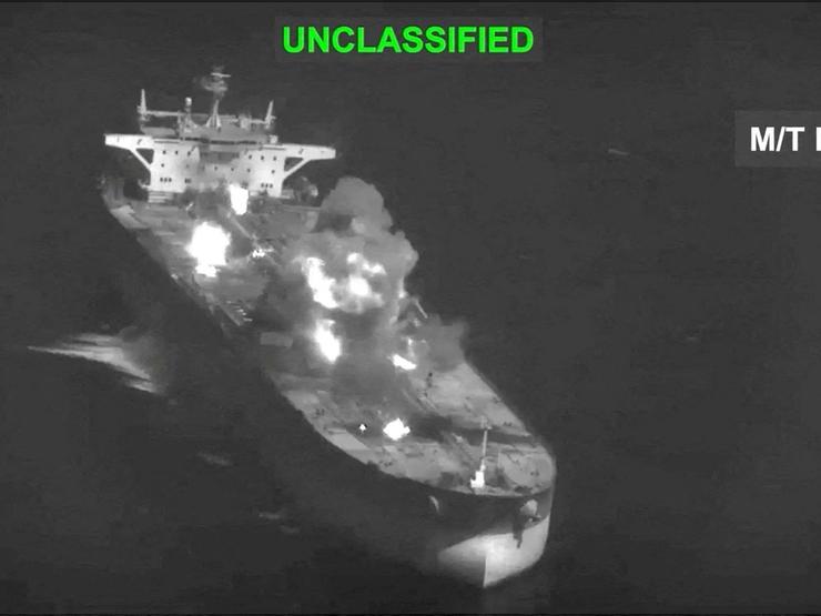 Fire and smoke rise during what CENTCOM says are strikes on Iranian oil carriers