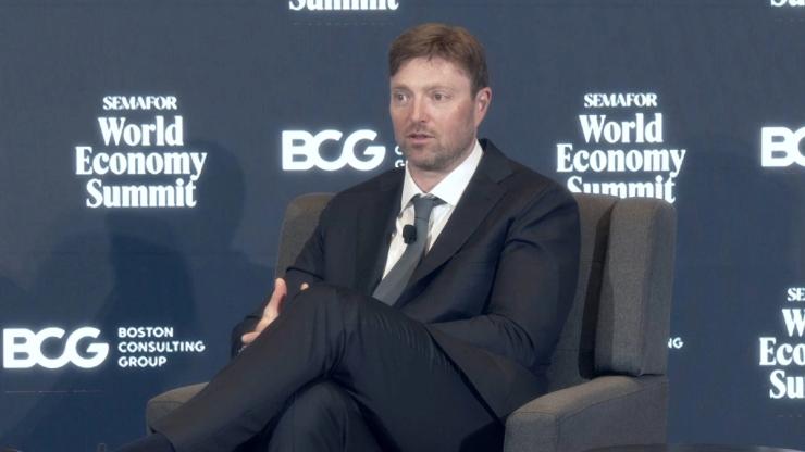 Alex Chriss on stage.