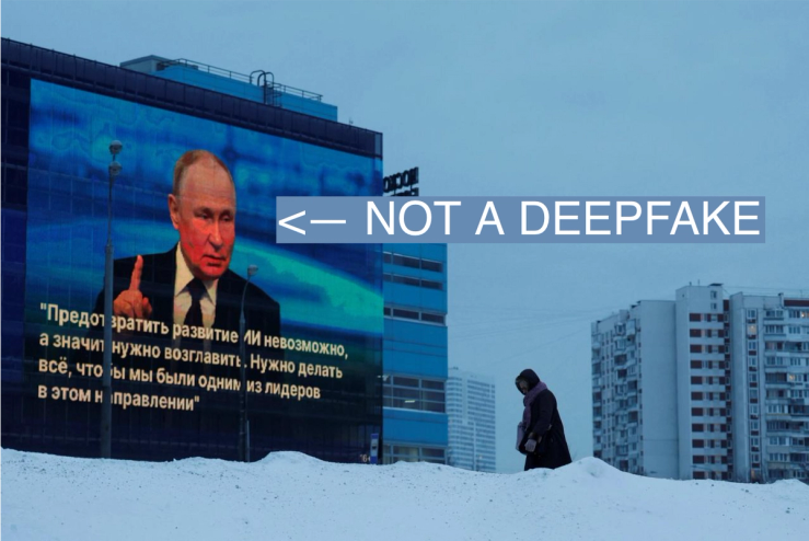 A woman walks past an electronic screen on the facade of a building showing an image of Russian President Vladimir Putin and a quote from his annual end-of-year press conference and the Direct Line question and answer session.