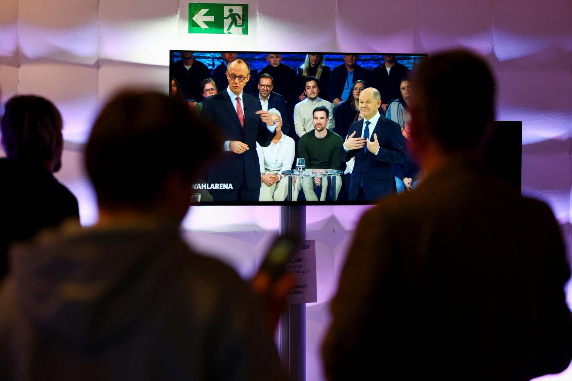 Germans watch a televised debate ahead of the elections.