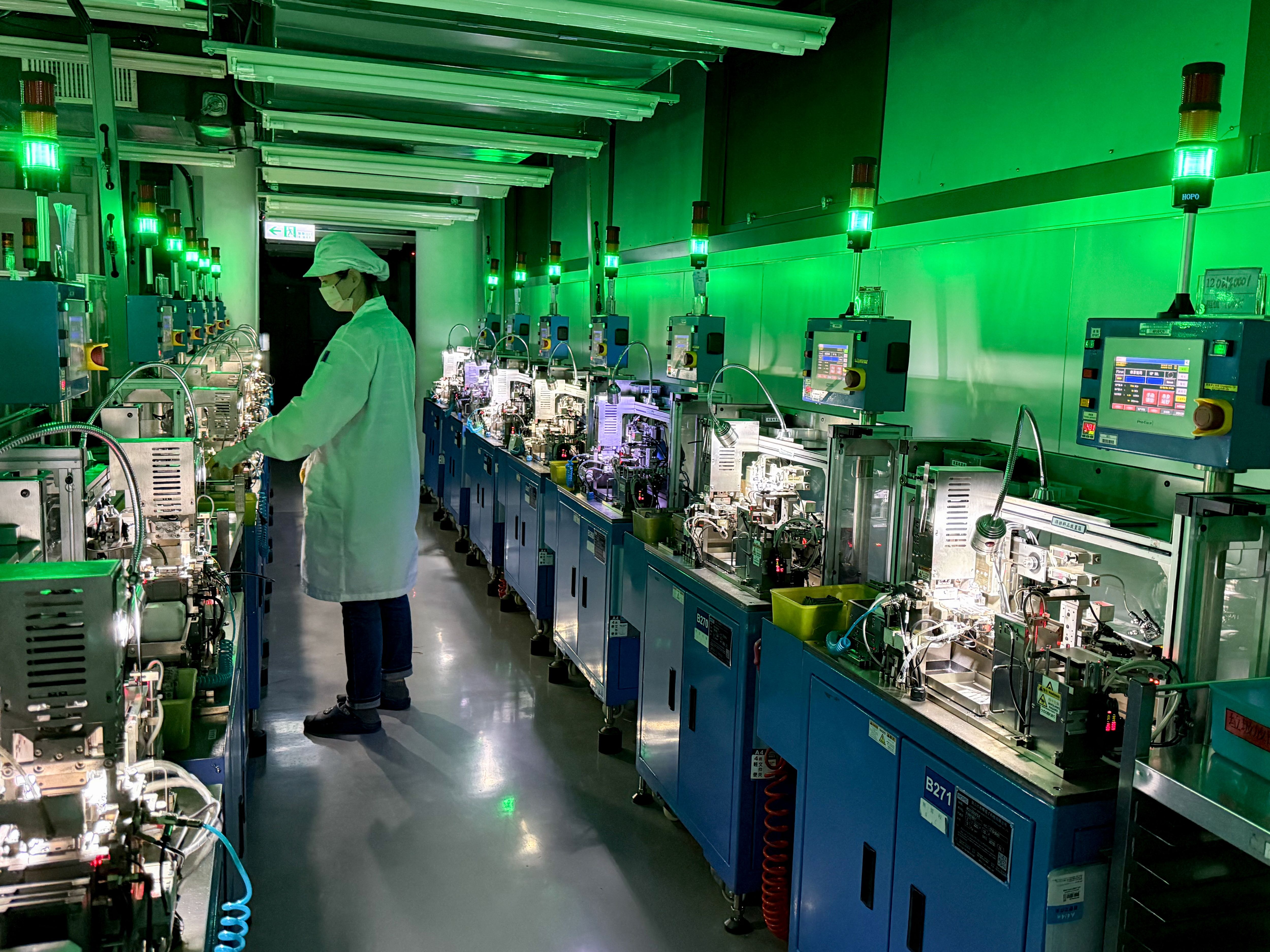 An employee reviews the chip resistor production line at Yageo’s factory in Kaohsiung, Taiwan.