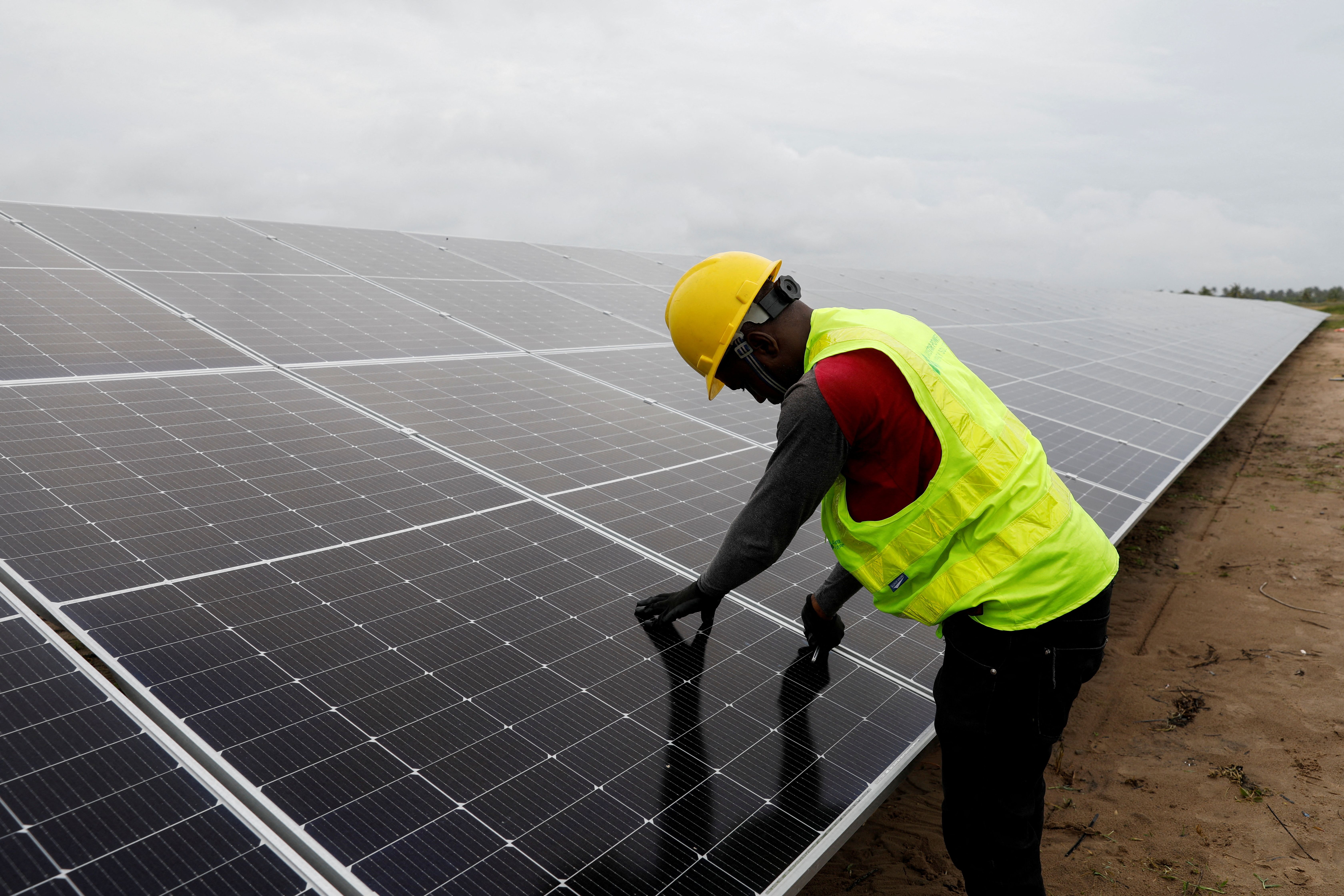 A technician works on solar power panels in Lagos, Nigeria. 