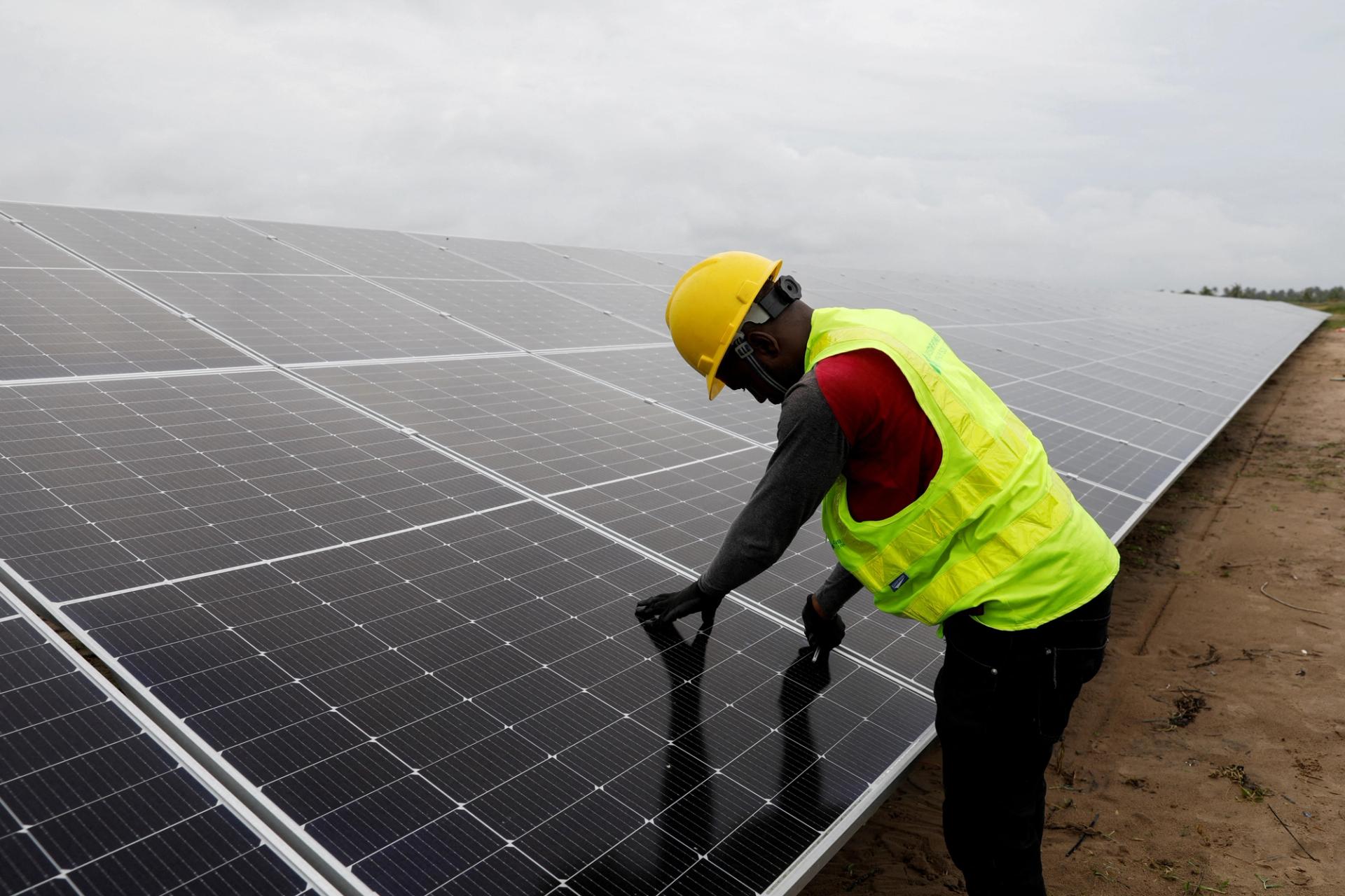 A technician works on solar power panels at the Atlantic Shrimpers farm in Badagry, Lagos, Nigeria.