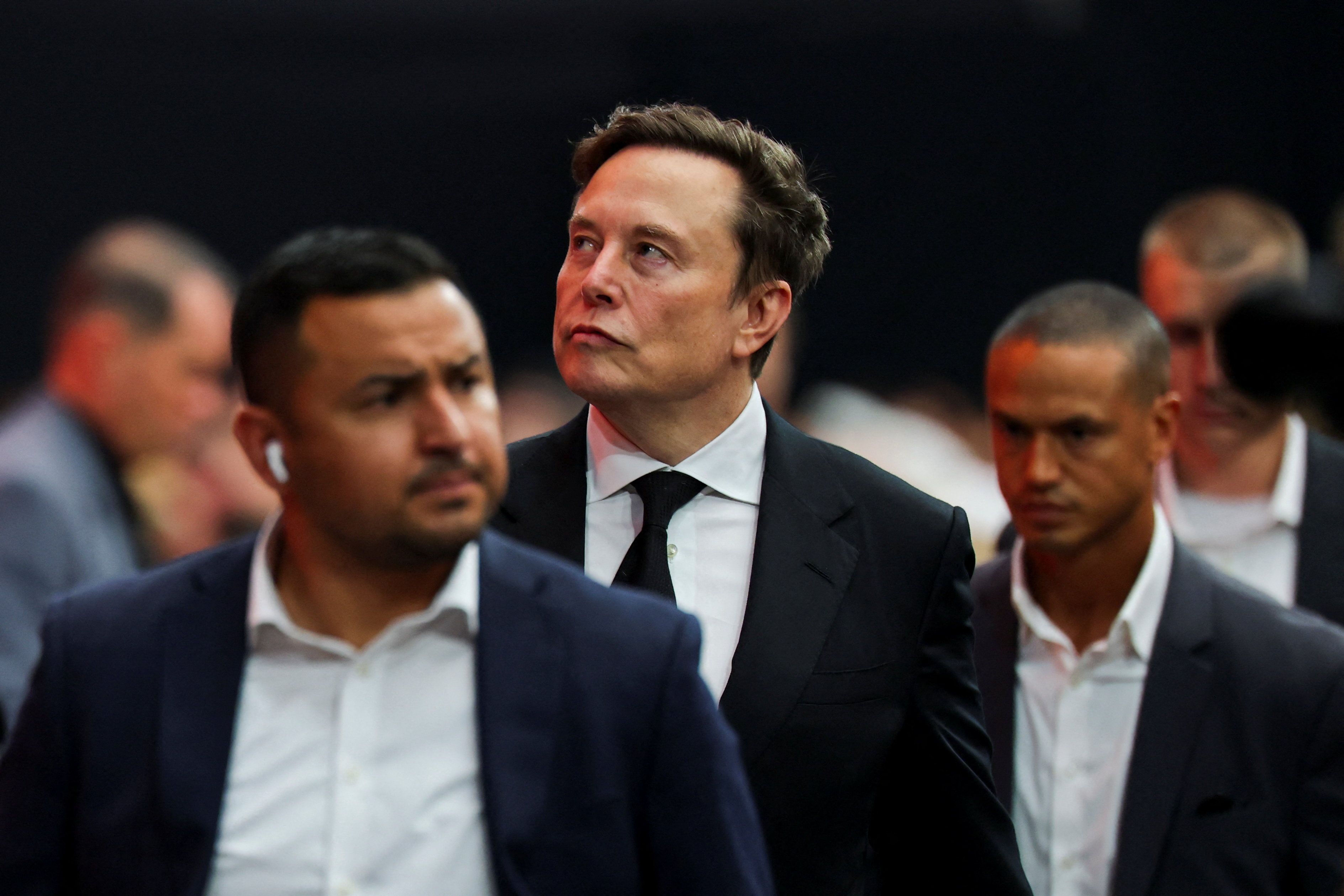 Tesla CEO Elon Musk attends a memorial service for slain conservative commentator Charlie Kirk at State Farm Stadium.