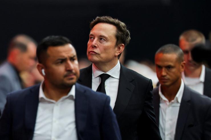 Tesla CEO Elon Musk attends a memorial service for slain conservative commentator Charlie Kirk at State Farm Stadium.