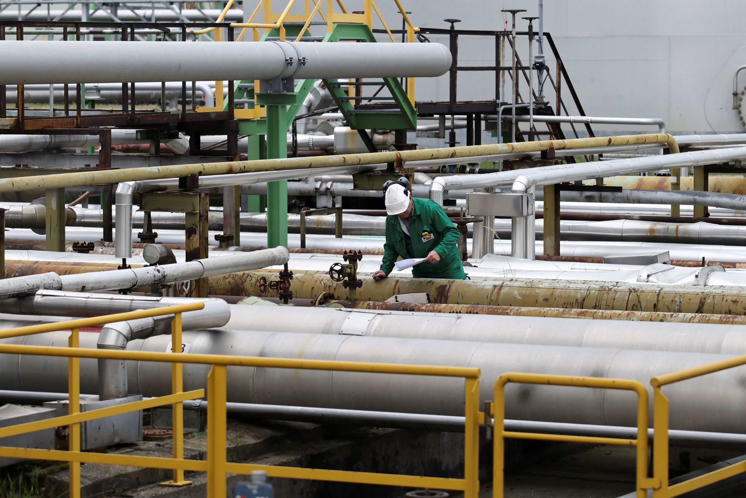 A man works at the PCK Schwedt oil refinery.