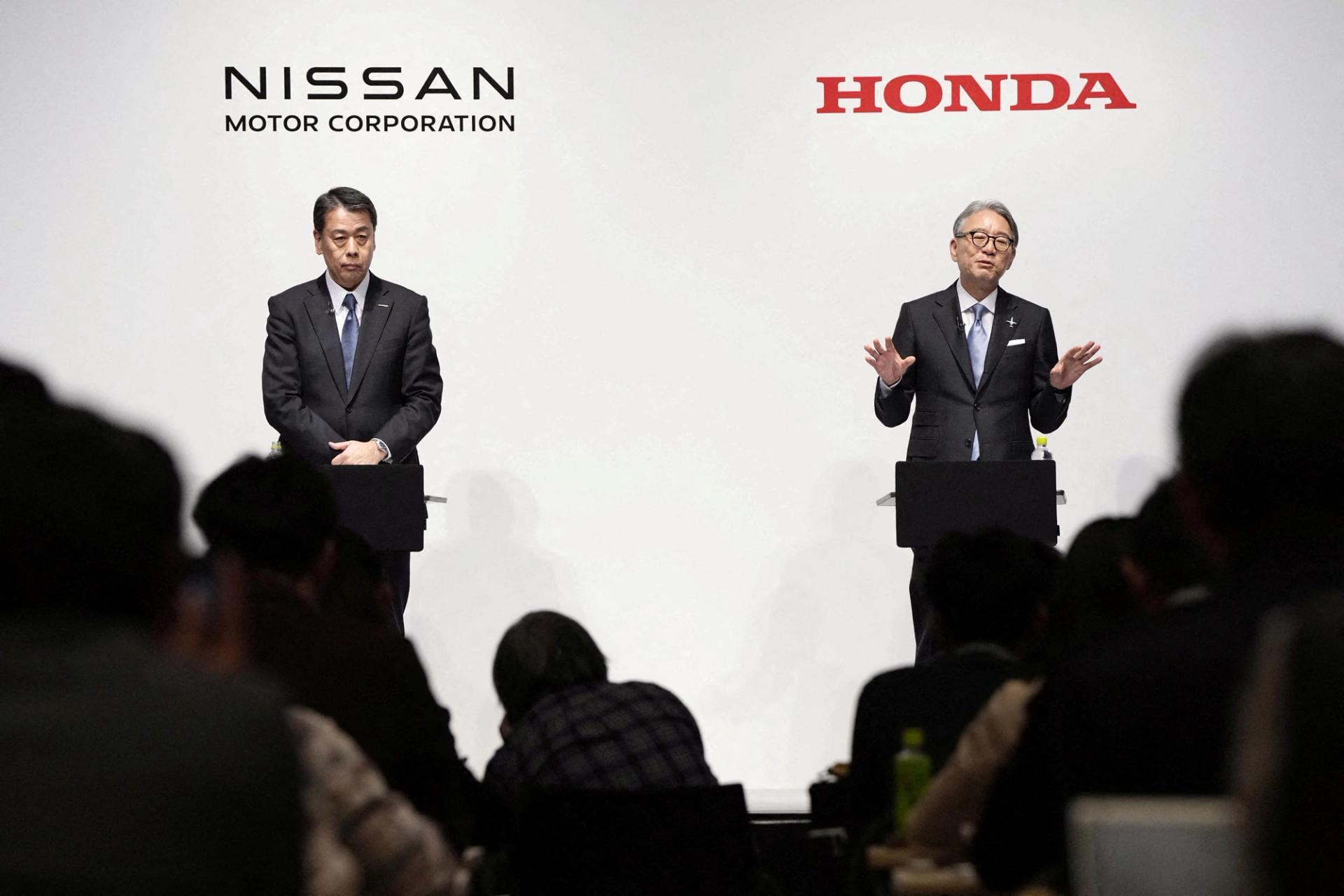 Makoto Uchida, president and CEO of Nissan Motor, and Toshihiro Mibe, Honda president and CEO, attend a joint press conference in Tokyo in March 2024.