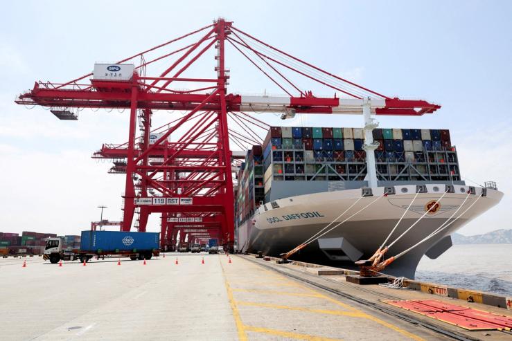 A container ship OOCL Daffodil is docked at Yangshan Port outside of Shanghai, China.
