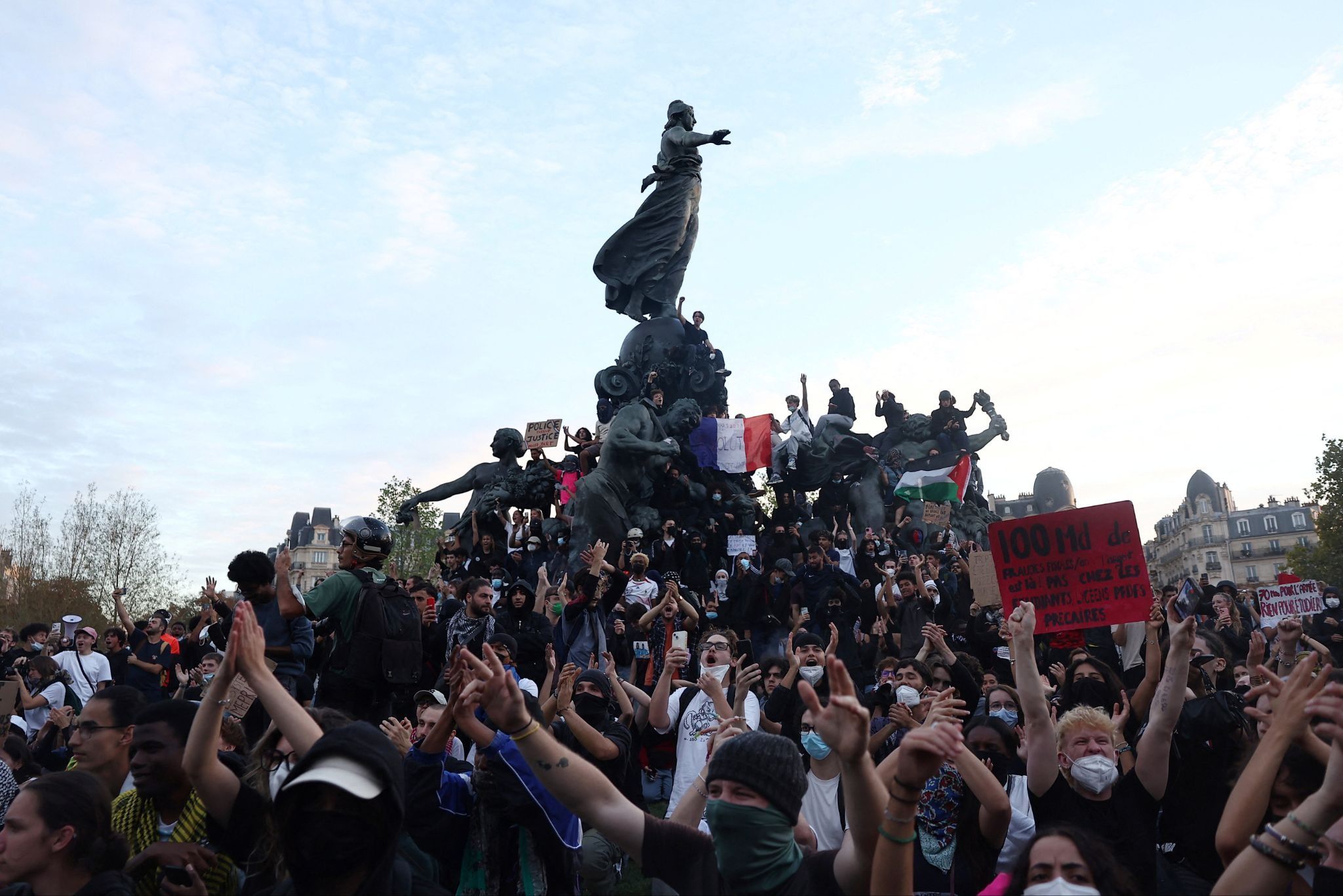 Protesters gather at the Place de la Nation during a demonstration by high school and university students. 
