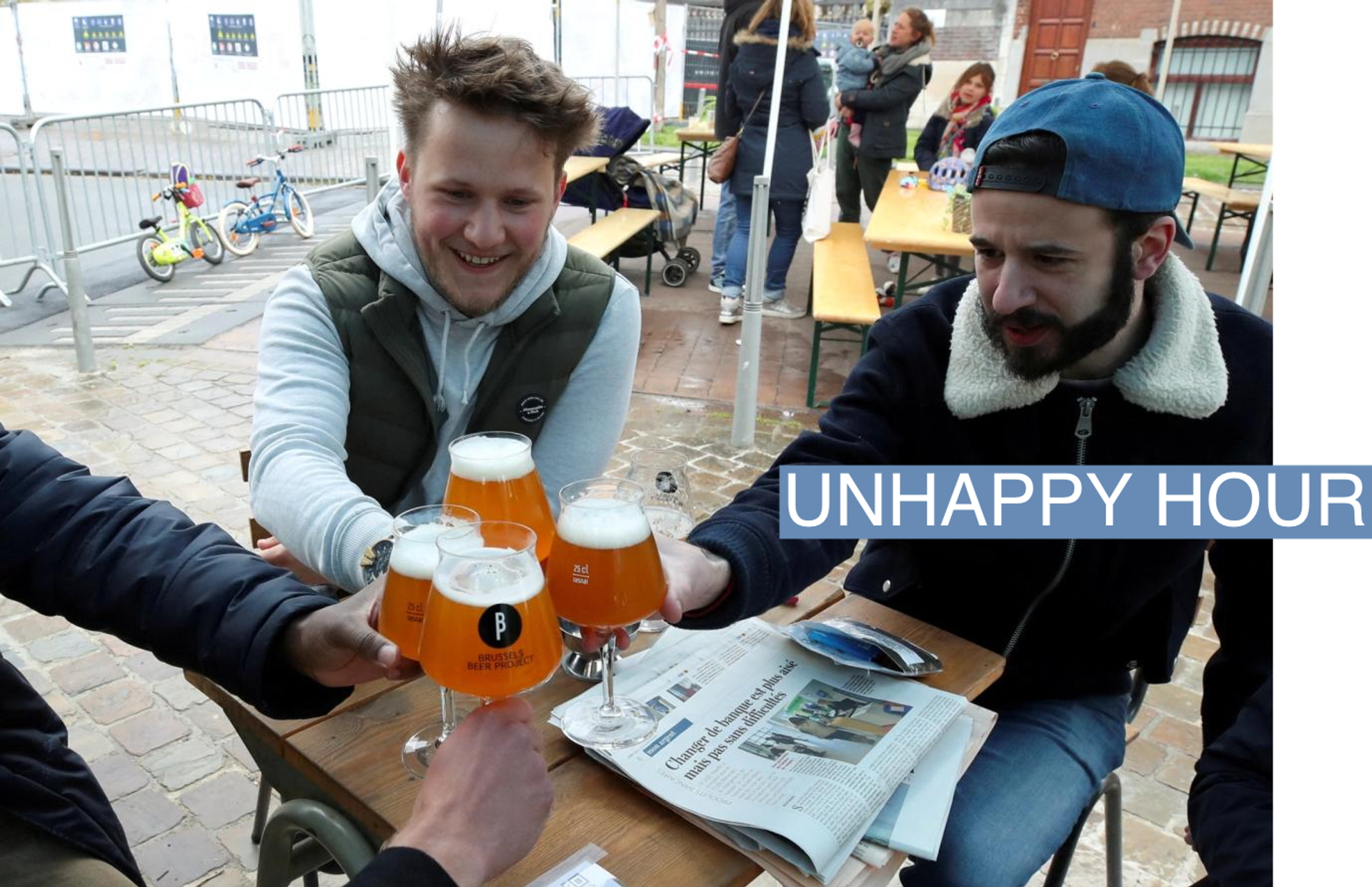 Customers enjoy a beer on the terrace at La Fourmiliere bar in Belgium.