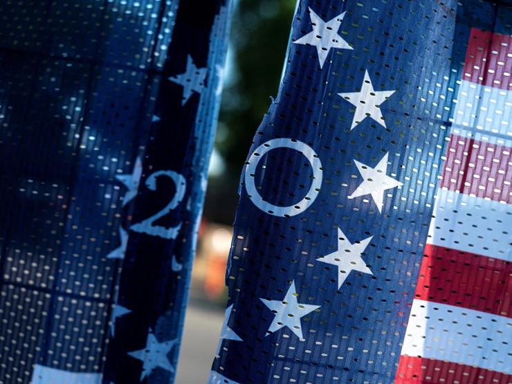 A torn America 250 banner