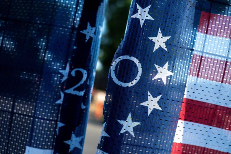 A torn America 250 banner