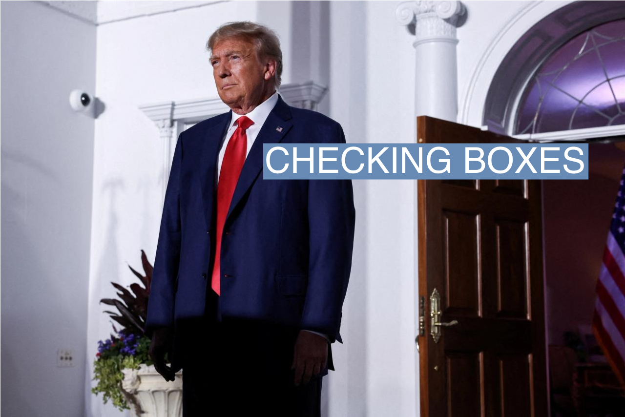 Former U.S. President Donald Trump reacts on stage following his arraignment on classified document charges, at Trump National Golf Club, in Bedminster, New Jersey.