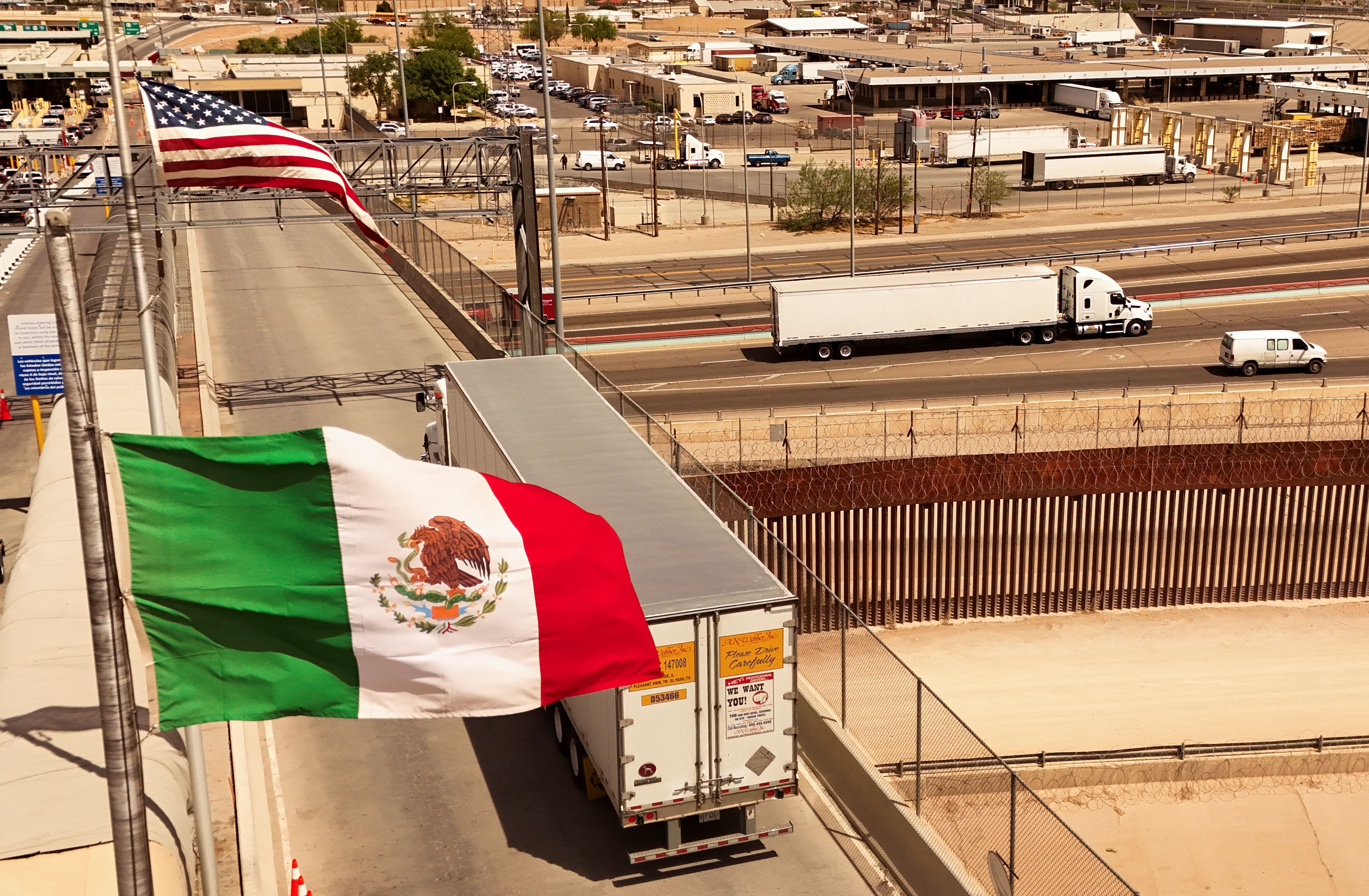 An aerial view shows a truck crossing into the United States over the Cordova of the Americas border bridge.