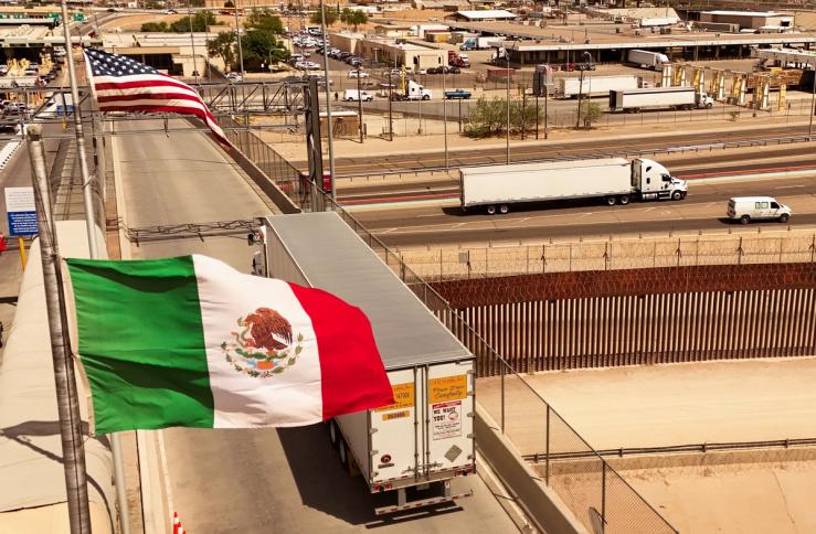 An aerial view shows a truck crossing into the United States over the Cordova of the Americas border bridge.
