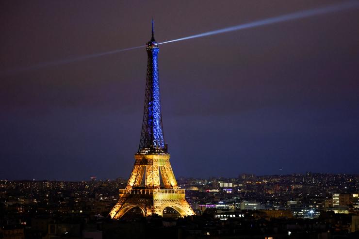 The Eiffel Tower is lit up in the national blue-and-yellow colours of Ukraine, to mark the first anniversary of Russia’s invasion of Ukraine, in Paris, France, February 23, 2023. REUTERS/Sarah Meyssonnier