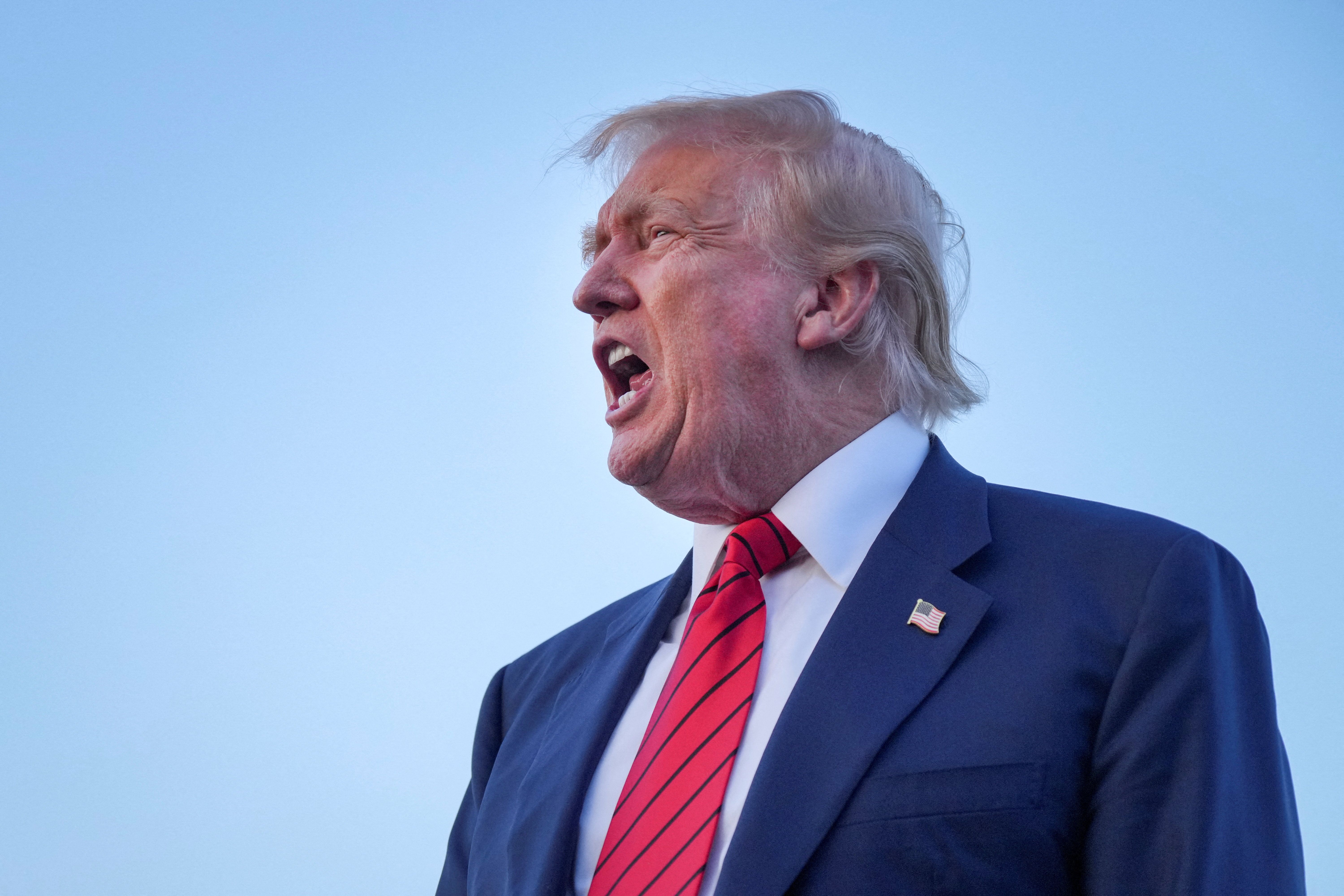 President Donald Trump speaks to the press prior to boarding Air Force One.
