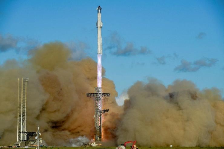 A SpaceX Super Heavy booster carrying the Starship spacecraft lifts off in Texas.