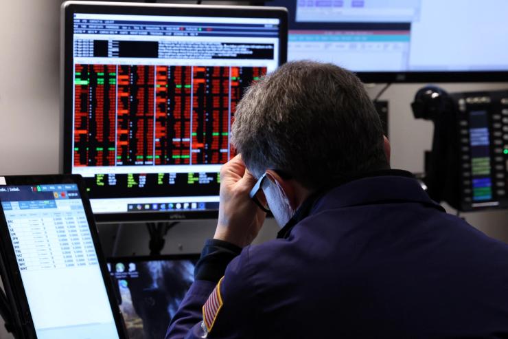 A trader works on the floor at the New York Stock Exchange.
