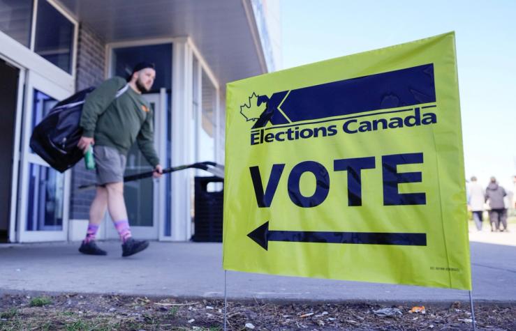 A man walks out of the polling station in Chambly, Quebec.