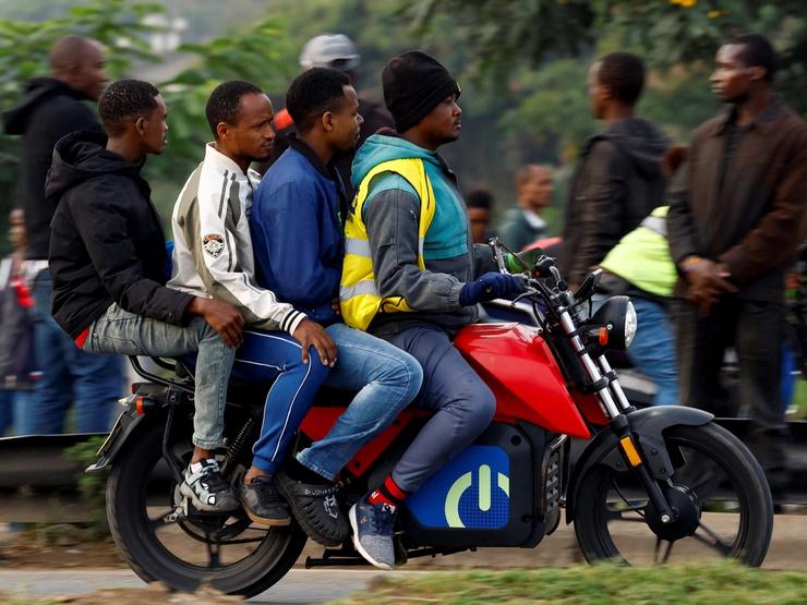 A motorcycle taxi carries passengers during a strike by public transport operators driven by rising fuel costs, linked to global supply pressures following the U.S.-Israeli conflict with Iran, in Nairobi, Kenya May 19, 2026. REUTERS/Thomas Mukoya