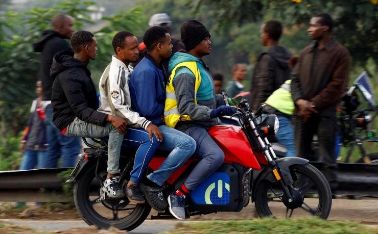 A motorcycle taxi carries passengers during a strike by public transport operators driven by rising fuel costs, linked to global supply pressures following the U.S.-Israeli conflict with Iran, in Nairobi, Kenya May 19, 2026. REUTERS/Thomas Mukoya