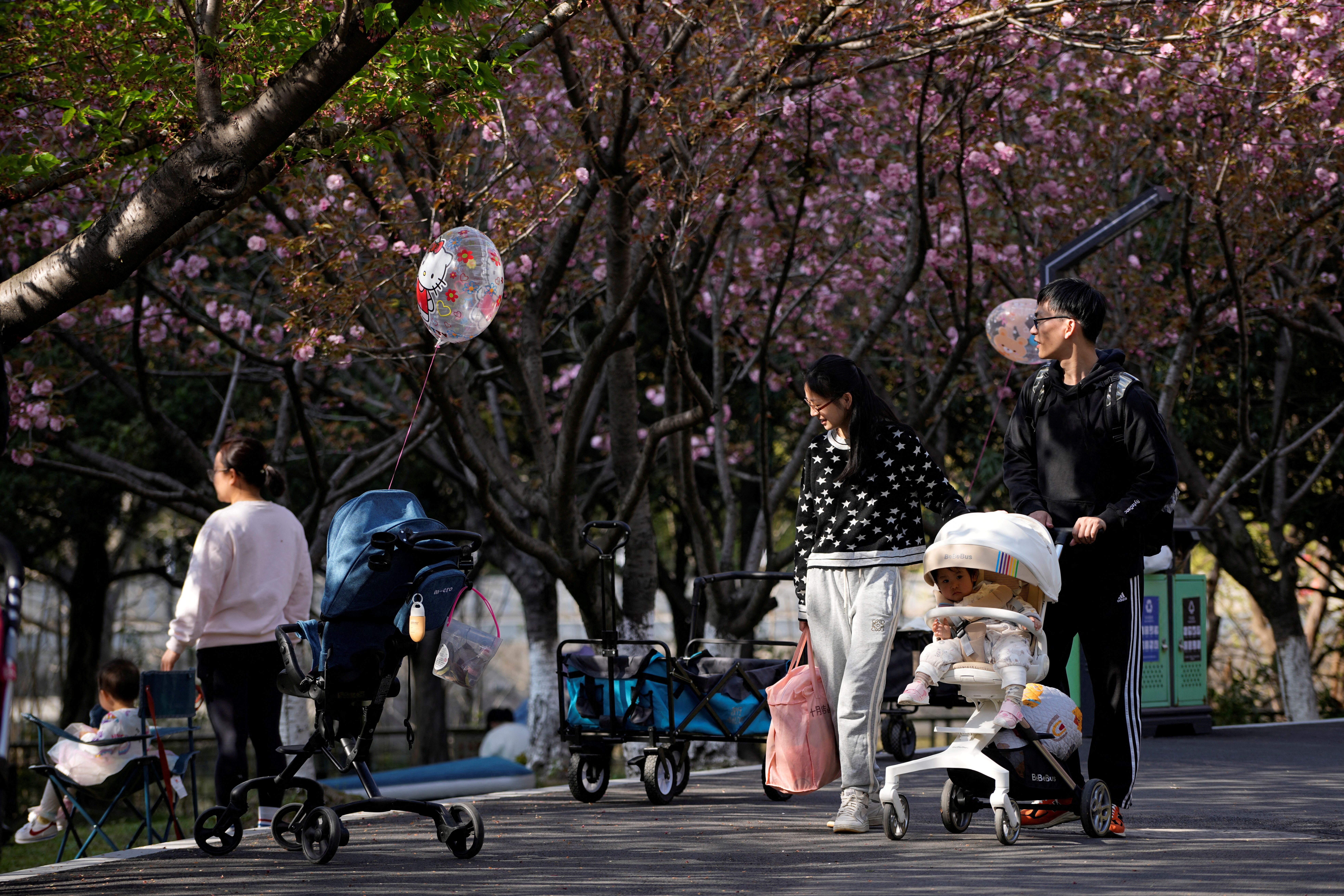 Parents pushing strollers in Shanghai