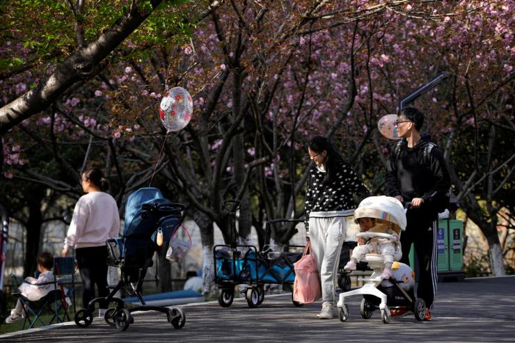 Parents pushing strollers in Shanghai