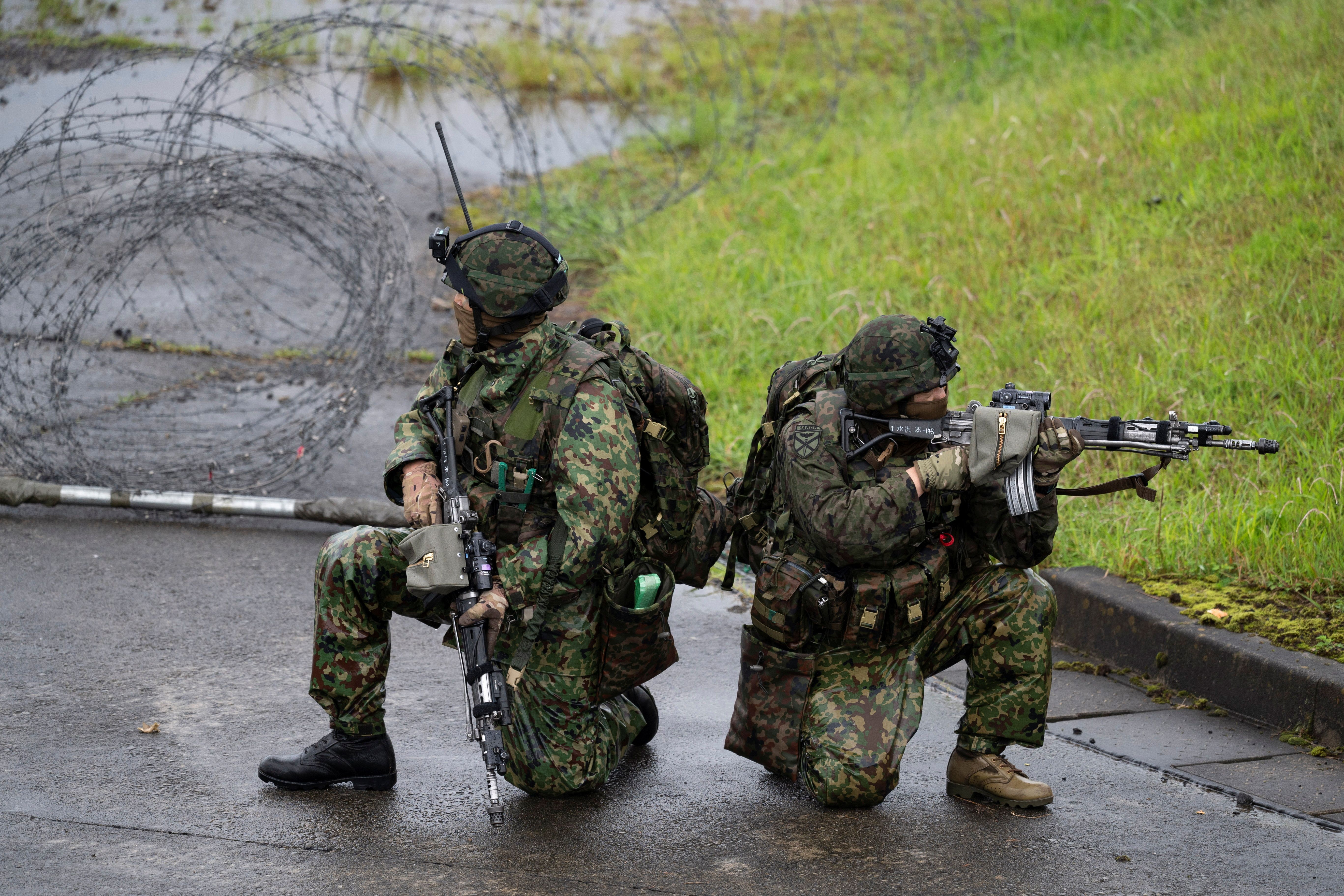 Japanese soldiers train during a joint military drill between Japan Self-Defense Forces, French Army and U.S. Marines, at the Kirishima exercise area in Ebino, Miyazaki prefecture, Japan 