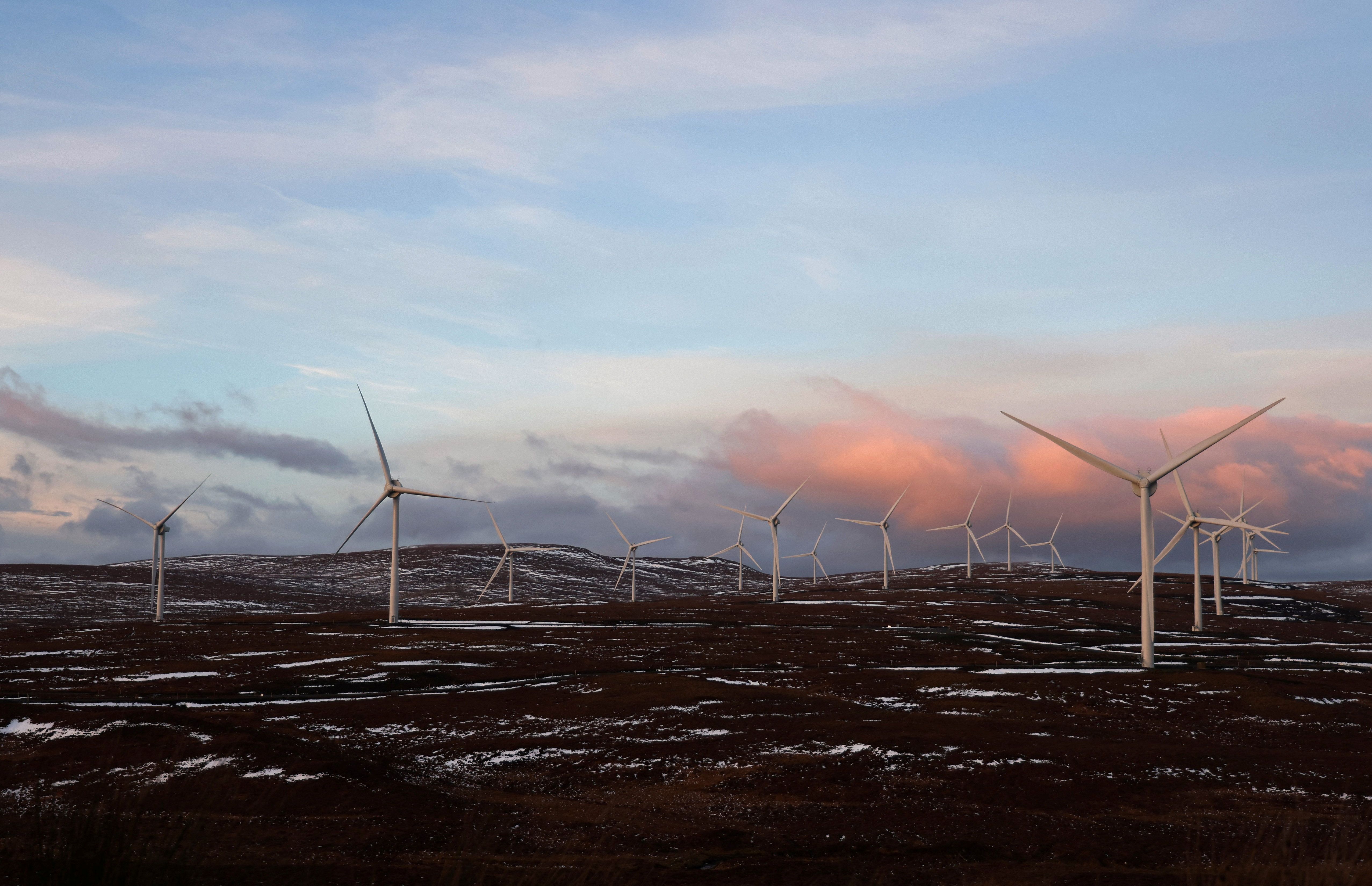 The sun sets over Creag Riabhach Wind Farm near Altnaharra, Scotland